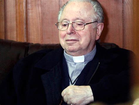 A member of the movement laicos de osorno holds up an image showing the rev. Hermano de Karadima: "Fernando es culpable, tiene que ...