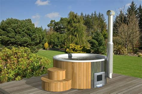 Each of our secluded log cabins has a hot tub located on the porch which is home to a hand made swing and rocking chairs. Log Cabins For Sale UK | Deluxe Euro Hot Tub