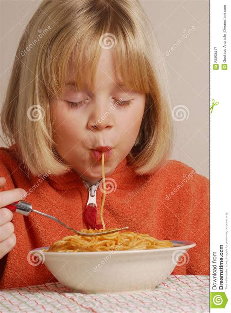 Kid eating spaguetti stock image. Image of closeup, ingredient - 23353417