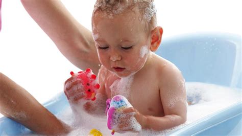 When you're done bathing him, quickly wrap him up in the towel so he doesn't lose too much body heat. How to Give a Newborn a Bath - Howcast