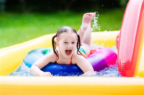 Produk asli, original, dan branded dengan beragam brand official. Little Girl In Garden Swimming Baby Pool Stock Photo ...