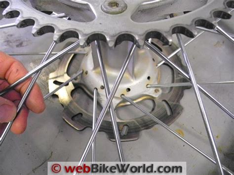 You will need to consult a table like the one on sheldon brown's page about measuring bicycle rims and hub flanges. How to Respoke Motorcycle Wheels - webBikeWorld