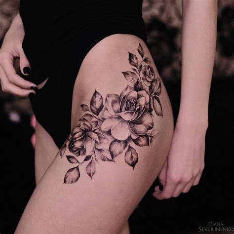Black rose tattoos done beautifully on her back with thorns and black leaves. Pin on tattoos