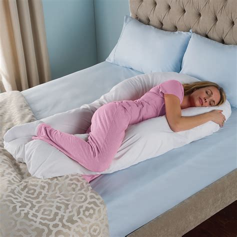 Helps keep pregnant people in a stationary sleeping position; The Total Body Support Pillow - Hammacher Schlemmer