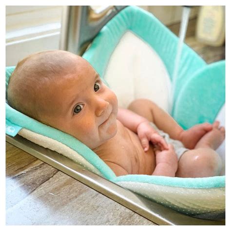 An inflatable bathtub lets you bathe baby on a counter or table. Blooming Bath Baby Sink Bath in 2020 | Blooming baby bath ...