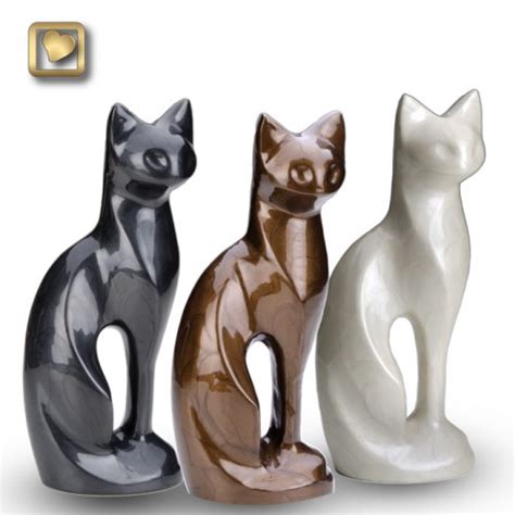 This urn offers you a choice of over 700 different purebred dog and cat figurines. Pearlescent White Cat Urn - Memorial Urns