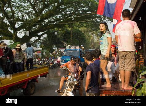 Lao girl dancing on a table, during water fight to celebrate Lao New ...