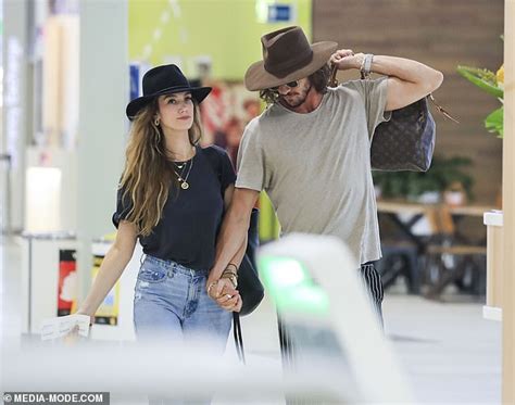 This opens in a new window. Delta Goodrem is seen sharing a passionate kiss with beau ...