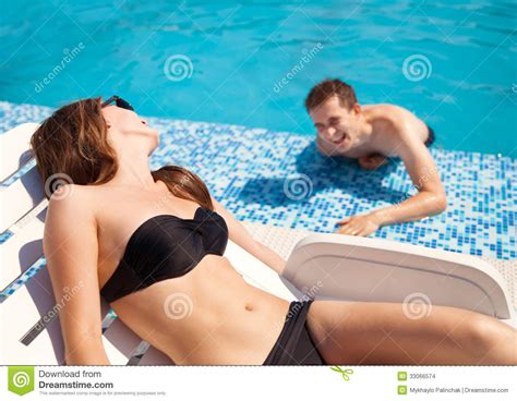 Select from premium sunbathing of the highest quality. Couple In Love Near Swimming Pool Stock Photo - Image of ...