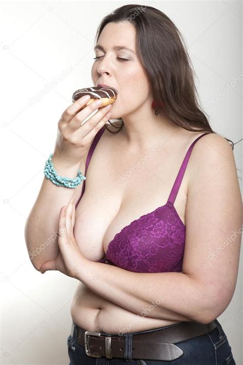 Heather vandeven in purple panties and a white bra. Chubby woman enjoys eating a chocolate donut — Stock Photo ...