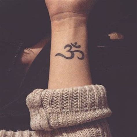 This will also bring a smile to the person who sees it. om tattoo on wrist | Hippie tattoo, Om wrist tattoo, Tattoos