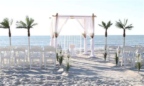 You may customize your beach wedding package with choice of colors, bridal aisle, wedding music, ceremonies and personal touches. The beach wedding aisle is lined with lanterns and grasses | Beach wedding aisles, Wedding aisle ...