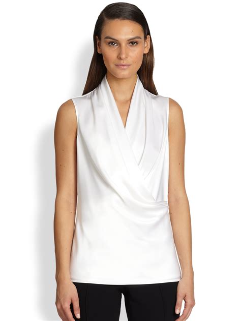 Channel an effortlessly elegant look with our collection of satin shirts and blouses for women. St. John Liquid Satin Wrap Blouse in Bright White (White ...