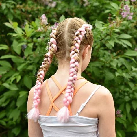 This one combines a dutch braid with two french braids from the top, woven up with bright yellow ribbons for an added finish. Dutch braids with pink extensions #kanekalon #dutchbraids | Dutch braid, Hair styles, Beauty