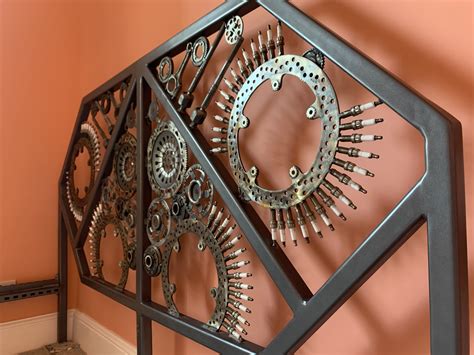 Groupon is featuring art heads custom framing today. Head board of bed made with steel framing, brake discs ...