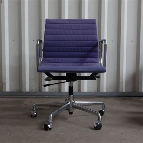 A place that the owner could come to to relax and forget about the problems of the day. 1958, Ray and Charles Eames Purple Adjustable Tilt Office Chair with Five Wheels For Sale at 1stdibs