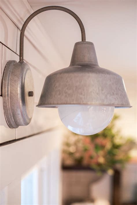 If you buy from a link, we may earn a commission. This Galvanized Dark Sky Wall Light above Tessa Kirby's ...